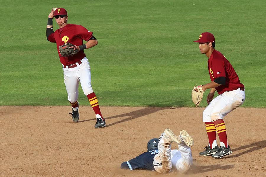 Alex Briggs throws out a runner from shortstop with Andres Kim covering at second in a recent game, photo by Richard Quinton.