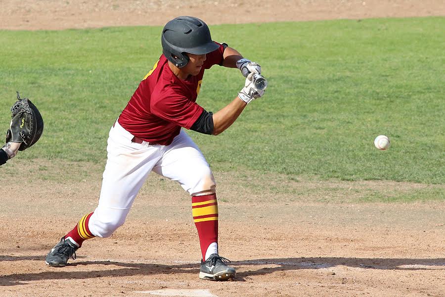 Part of PCC head coach Pat McGee's offensive plan is moving runners over. Andres Kim drops a bunt here in a recent game, photo by Richard Quinton.