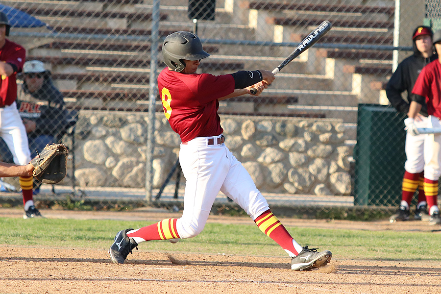 Second baseman Jose Jimenez drives a double to the gap in the eighth inning to help the Lancers to their third straight win on Tuesday, photo by Richard Quinton.