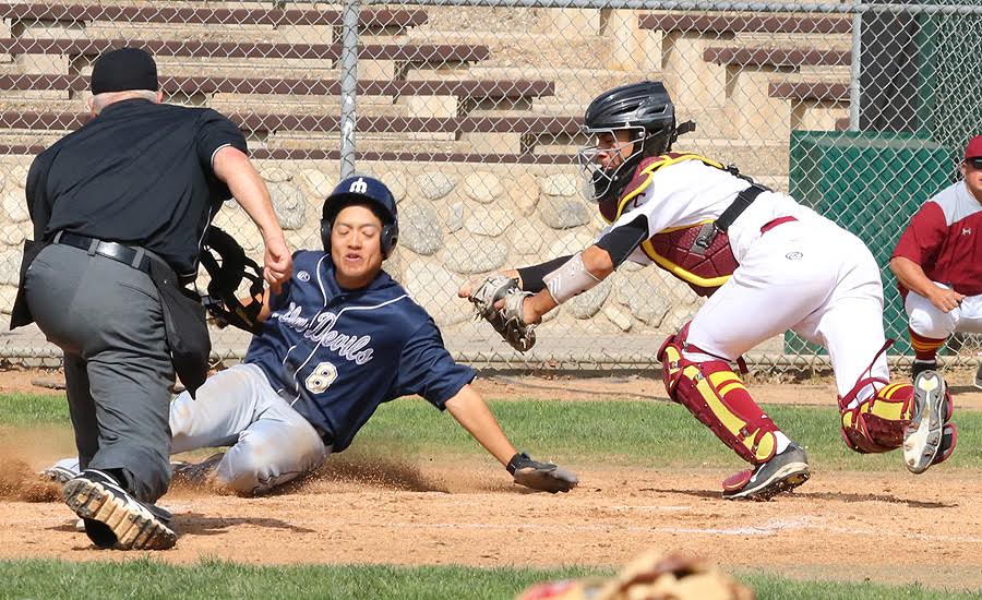 PCC catcher Jessie Garcia applies the tag at home plate to prevent a run in Thursday's loss to Merced, photo by Richard Quinton.