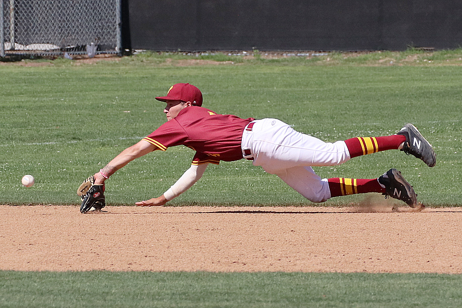 Lancers shortstop Ryan Lewis makes the diving catch on this liner before it could reach the dirt on Wednesday, photo by Richard Quinton.