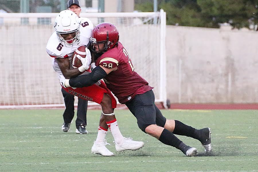Freshman safety Andy Reyes makes the open field tackle during PCC's season-opening loss Saturday night v. Long Beach City College, photo by Richard Quinton.