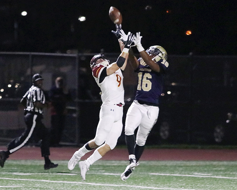 Lancer Forest Fajardo breaks up a pass during the team's 42-24 win at LA Harbor College Saturday evening, photo by Richard Quinton.