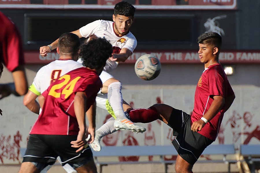 Lucas Rodriguez gets up high to deliver a shot during PCC's win at Glendale College Friday, photo by Richard Quinton.