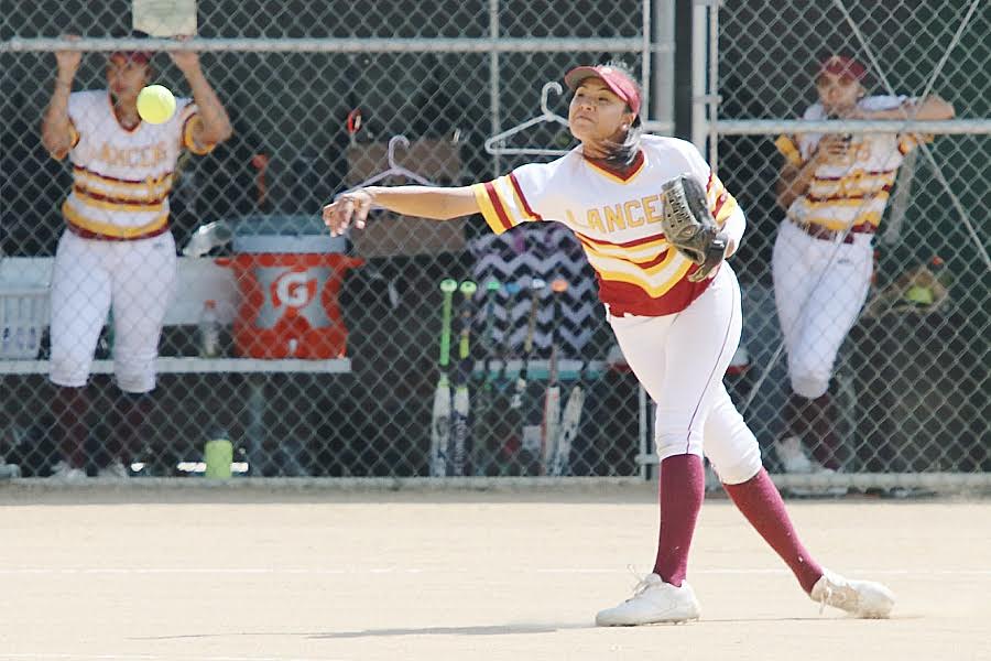 Lancer third baseman Brittany Ching fires a ball to first during PCC's win Thursday at Robinson Park, photo by Richard Quinton.