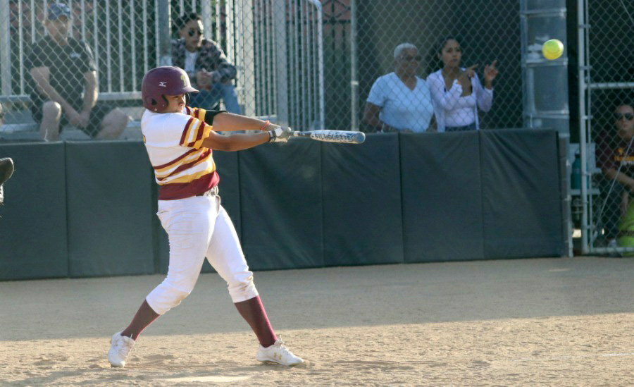 Nat Velasquez rips her 2-RBI double during PCC's win Tuesday at Robinson Park, photo by Richard Quinton.