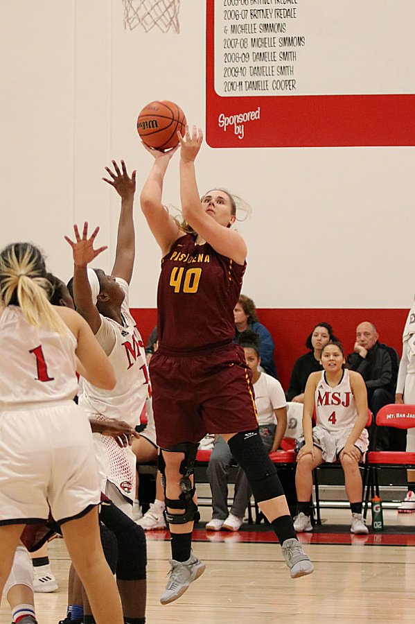 Alisa Shinn breaks the 1,000 point mark for PCC on this basket during the team's playoff loss at Mt. San Jacinto College Saturday evening, photo by Richard Quinton.