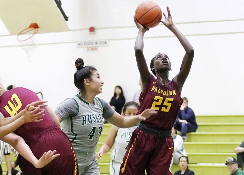 Lancer Mercy Odima goes up for a shot attempt during PCC's loss at East Los Angeles College, photo by Richard Quinton.
