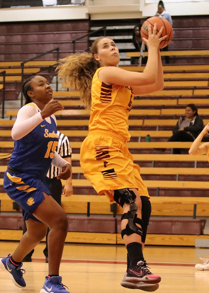 Lancer Alisa Shinn had a game for the ages when she scored 34 points and grabbed 25 rebounds in PCC's win over LA Southwest at the President's Roundball Classic on Friday afternoon, photo by Richard Quinton.