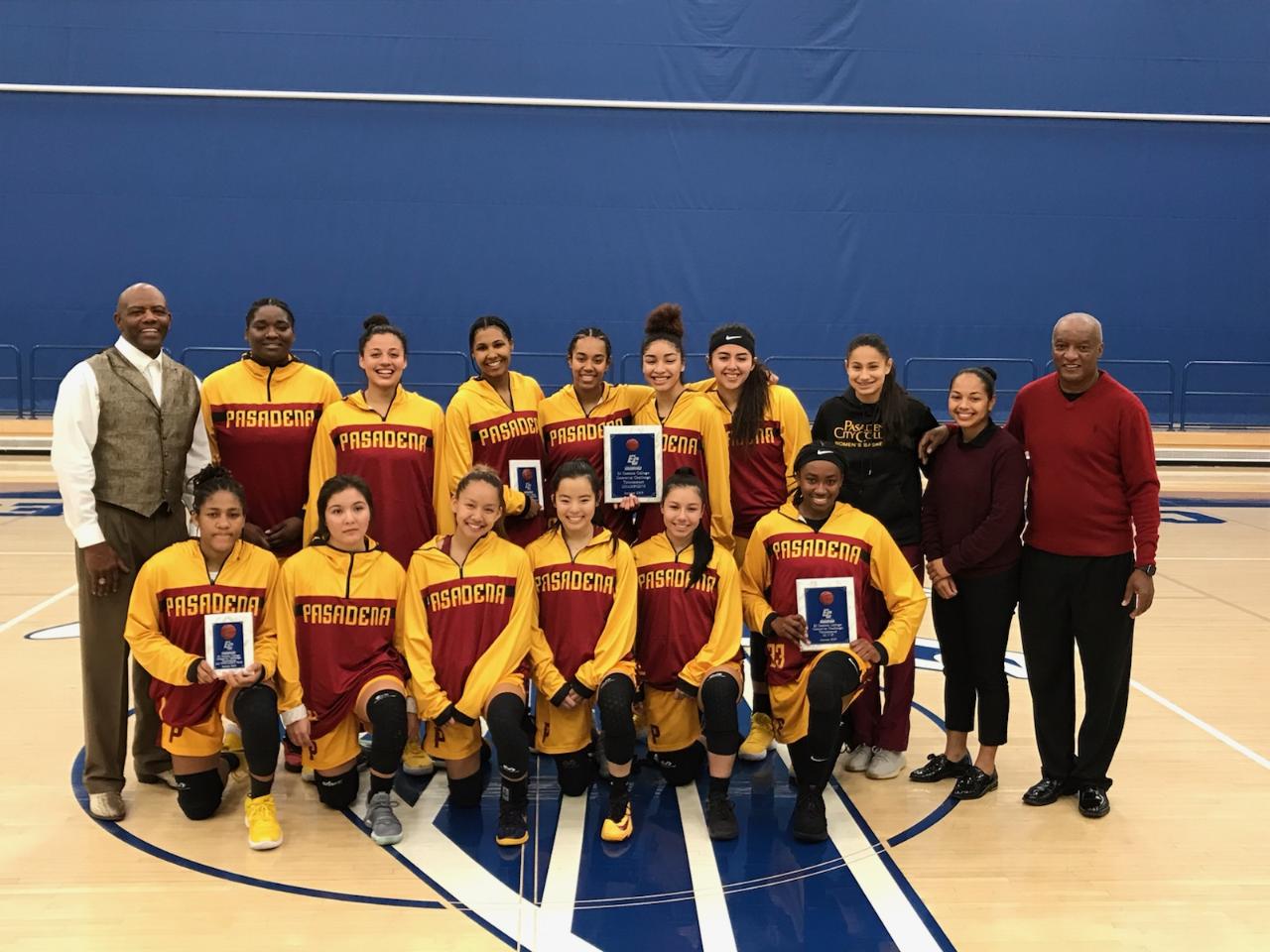 PCC takes a team photo following winning the Crossover Challenge Tournament title Friday night. MVP Dariel Johnson is in the bottom row far right holding her award.
