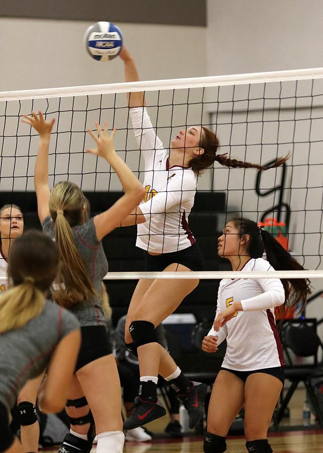 Danielle Johnson pounds a kill with setter Emily Leung looking on during PCC's season opener at the Pierce 3rd Kickoff Classic Friday, photo by Richard Quinton.