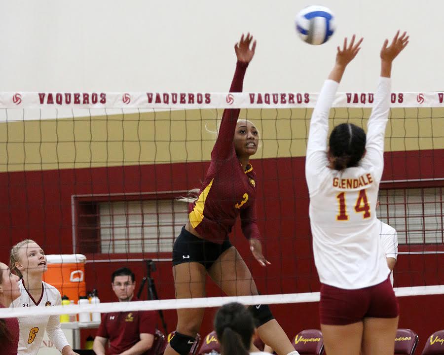 Kendall Schmedes goes up to rip a kill during PCC's sweep at Glendale Friday night, photo by Richard Quinton.