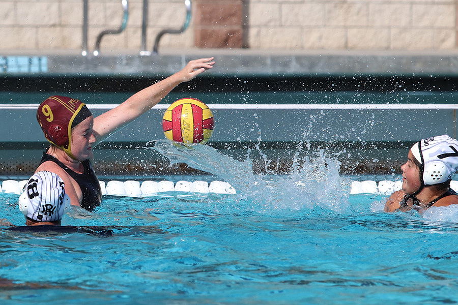 Lancer Camila Grases (red 9) makes the field block on a Rio Hondo shot during Monday's loss at the PCC Aquatic Center, photo by Richard Quinton.