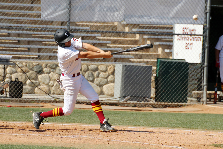 Lancer Edward Manzo, an All-SCC First Team selection as a freshman, raised his average to .387 this week. He rips a hit in Tuesday's victory, photo by Richard Quinton.
