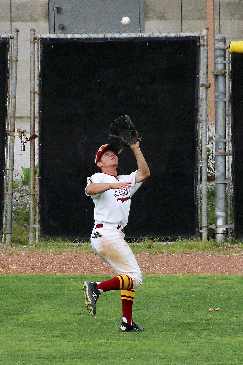 Lancer outfielder Edward Manzo flags down a fly ball during PCC's loss on Thursday, photo by Richard Quinton.