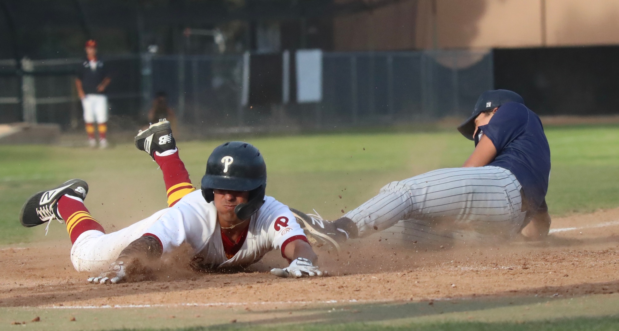 Lancer Aryonis Harrison beats the throw home during PCC's win on Thursday, photo by Michael Watkins.