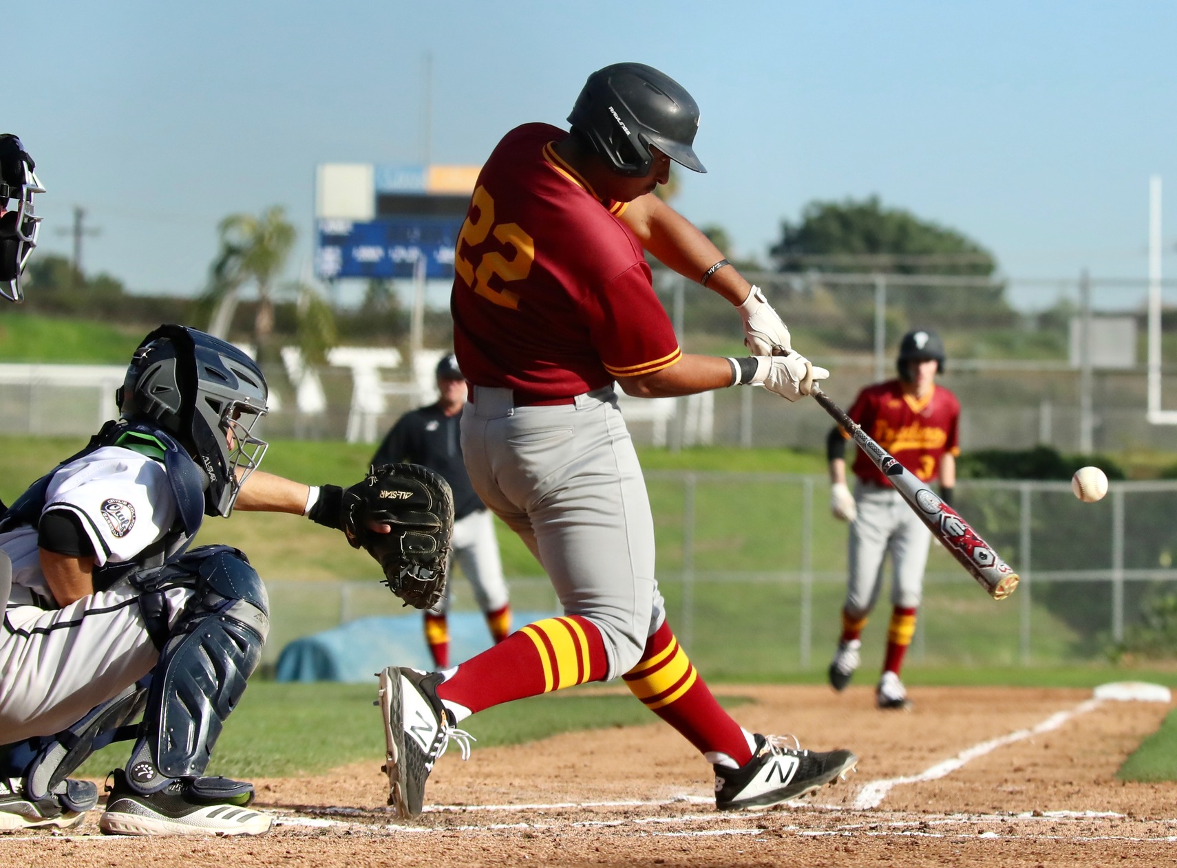 Marco Martinez opens the 2020 PCC baseball season with a grand slam HR on this swing at Citrus College on Friday, photo by Michael Watkins.
