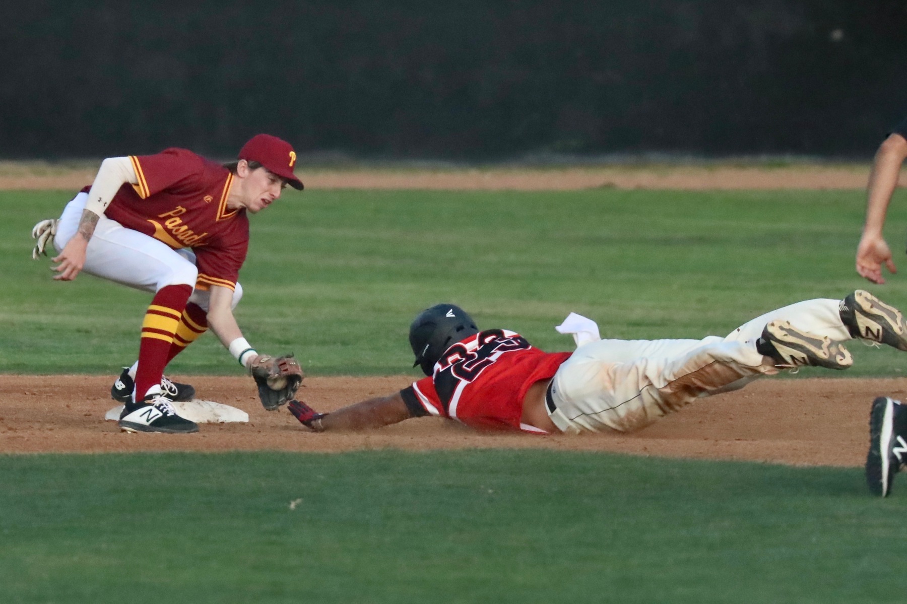 Lancers shortstop Jacob Ogle applies the tag on a Pierce baserunner during the team's game on Thursday, photo by Michael Watkins.