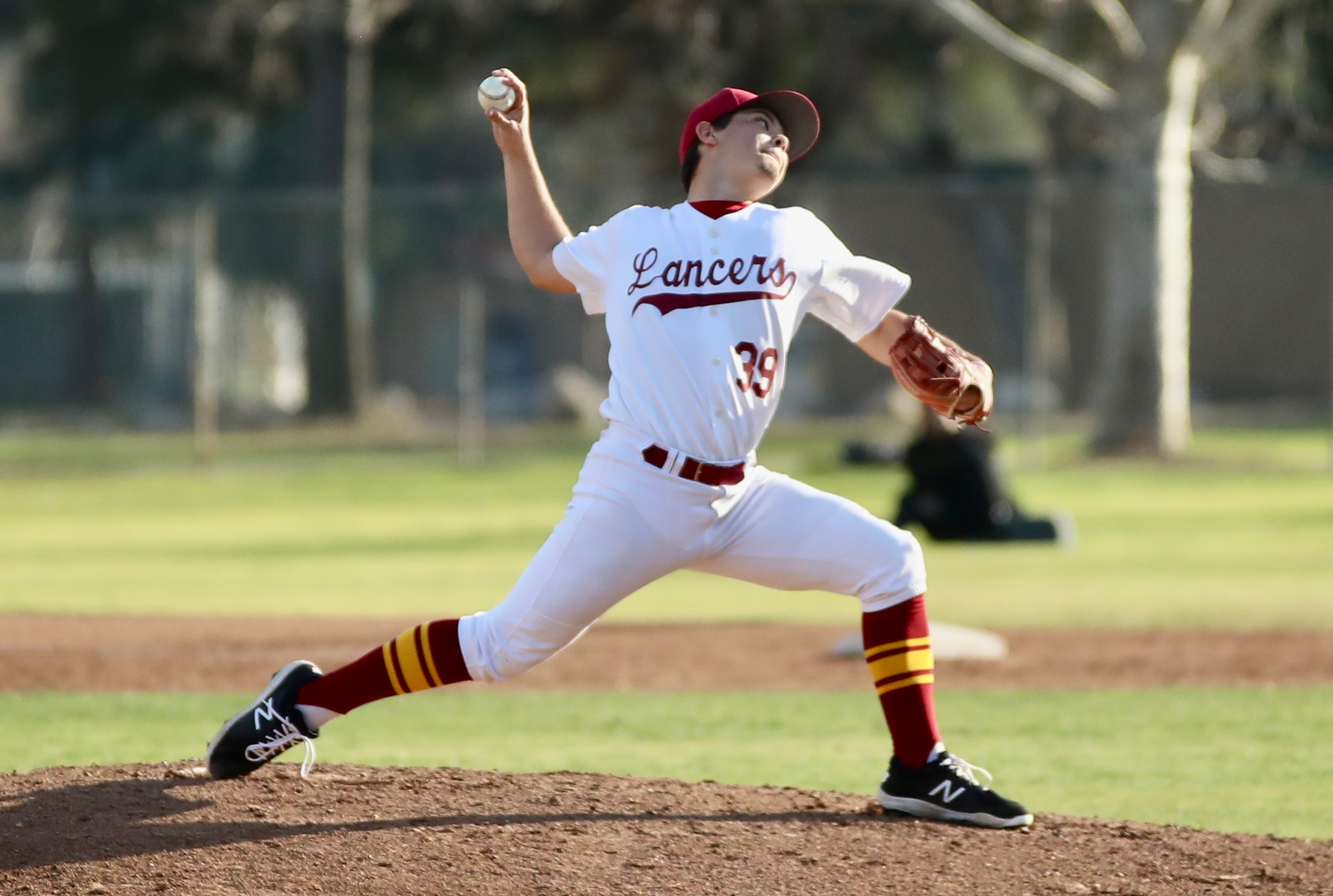 Rider Gardner fires a pitch in Thursday's win at Brookside Park (photo by Michael Watkins, Athletics).
