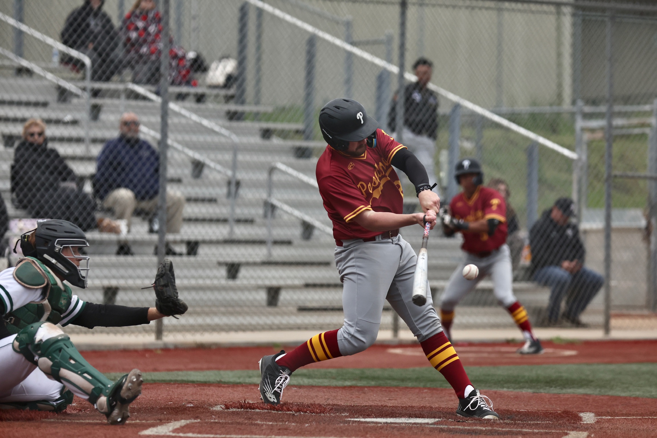 Jake Trabbie rips a ball during the ELAC-PCC series (photo by Michael Watkins).