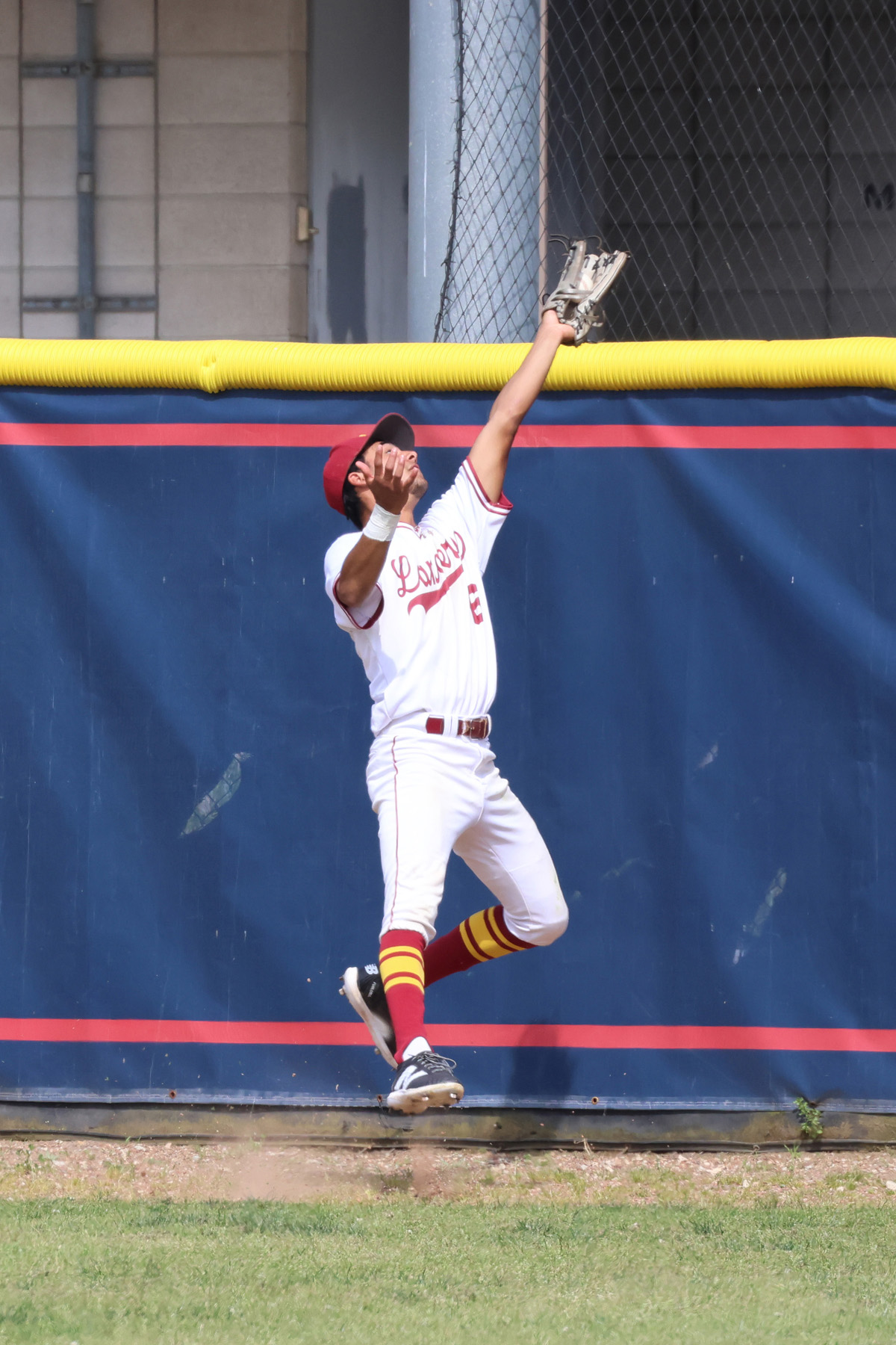 Thomas Villanueva with the circus catch that led to a double play in PCC's win on Wednesday (photo/gallery by Richard Quinton).