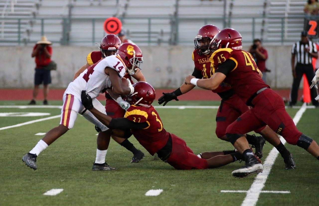 Darren Meyers (making tackle) led PCC in tackles with 10 on Saturday night, photo by Michael Watkins.