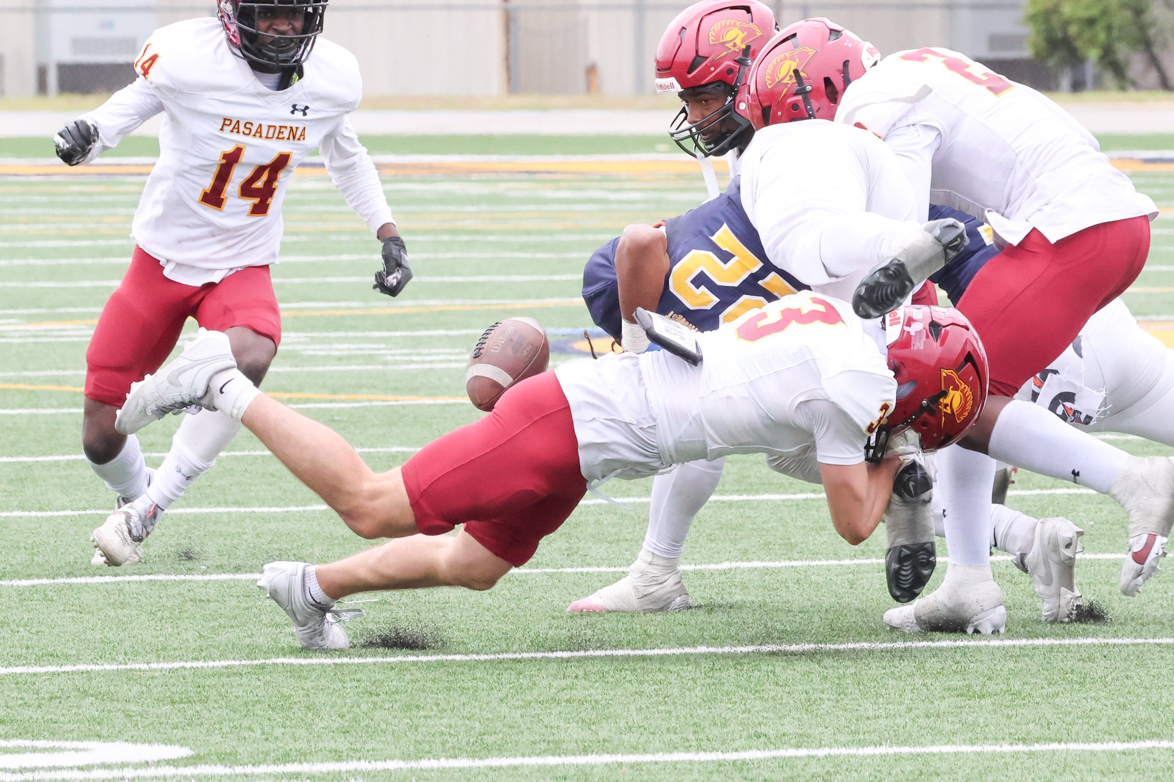 Eli Moulton forces a fumble in PCC's win at LA Southwest College (photo by Richard Quinton).