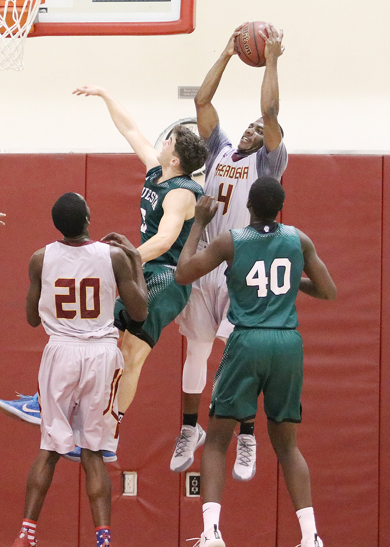 Lancer Giovonni Jackson grabs the rebound during PCC's playoff loss to Cuesta Wednesday night, photo by Richard Quinton.