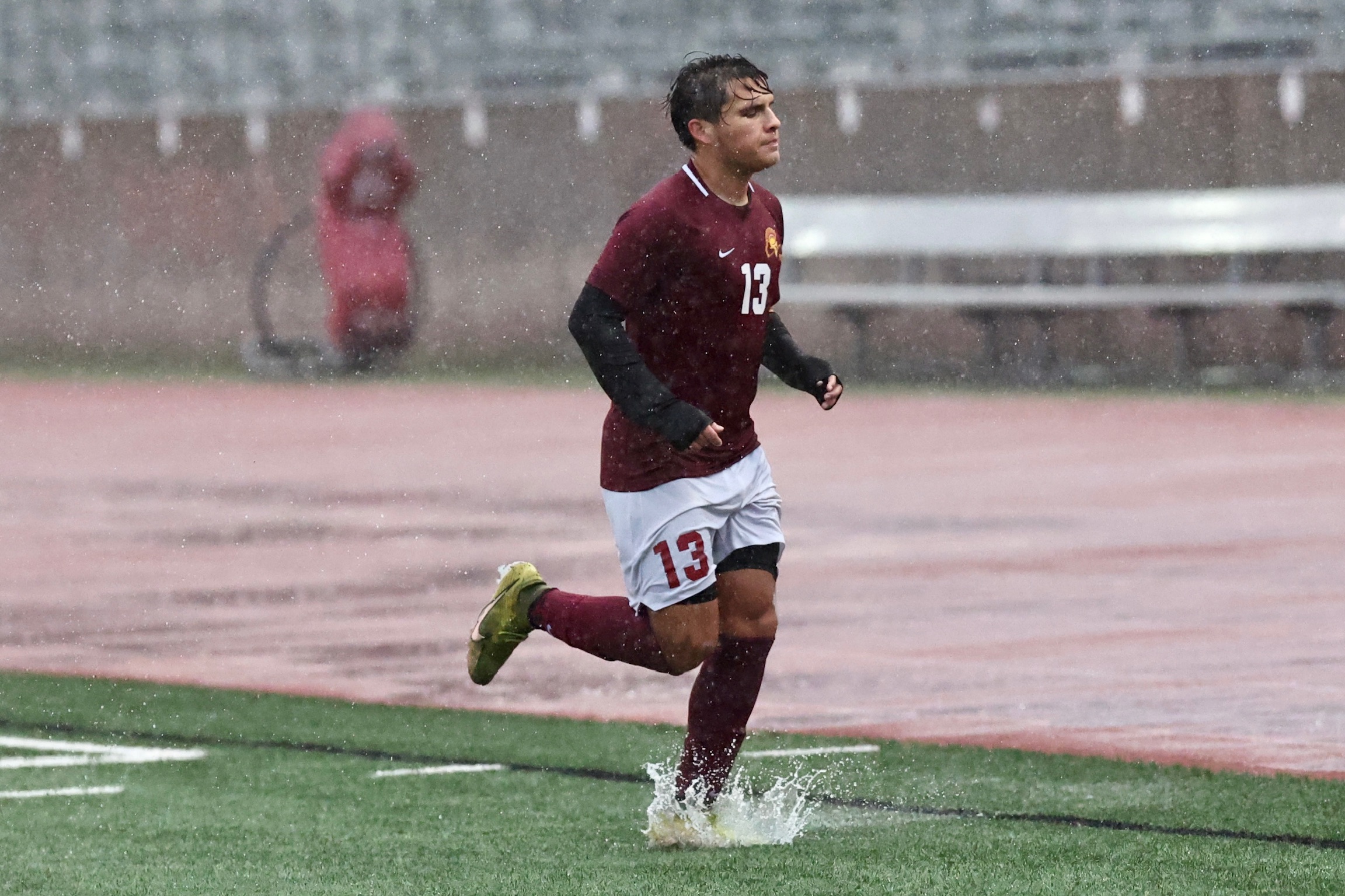 Esai Matchan running through rain-soaked Robinson Stadium following his first goal on Tuesday (photo by Michael Watkins).