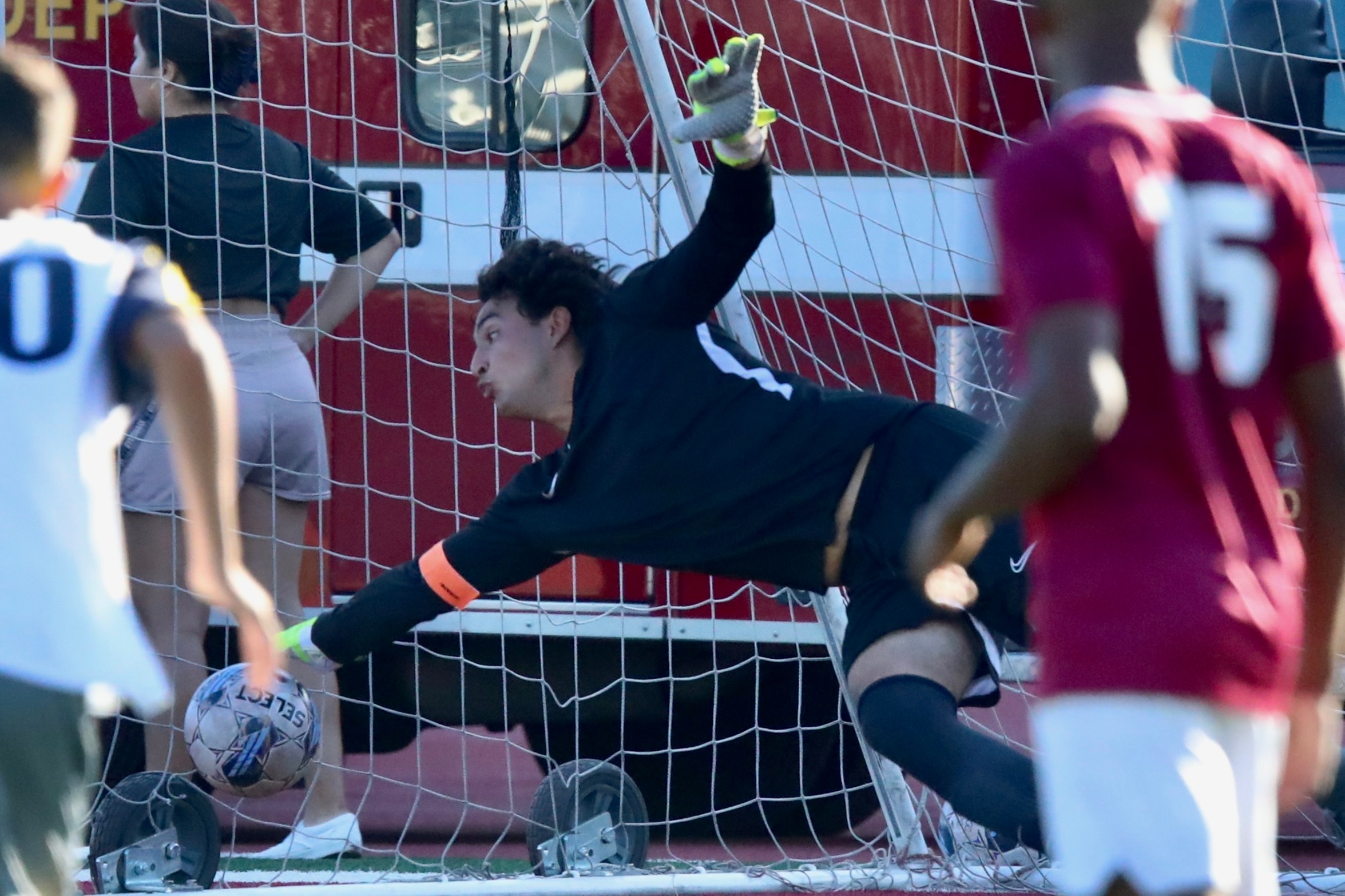 Kristopher Gutierrez makes this save on a penalty kick during PCC's season opening win over Canyons Friday at Robinson Stadium (photo by Michael Watkins).