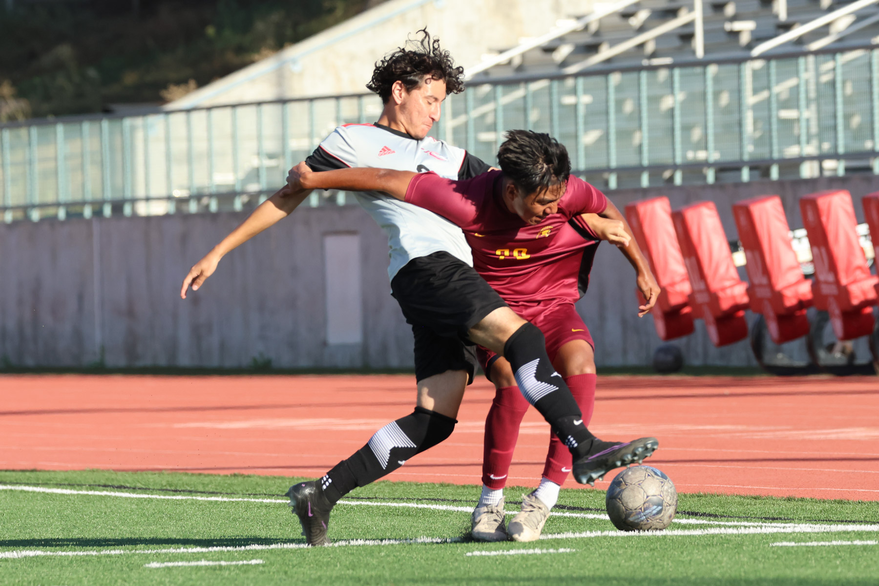 PCC's Miguel Medina fights for the ball v. a Compton player in Friday's  victory (photo by Richard Quinton).