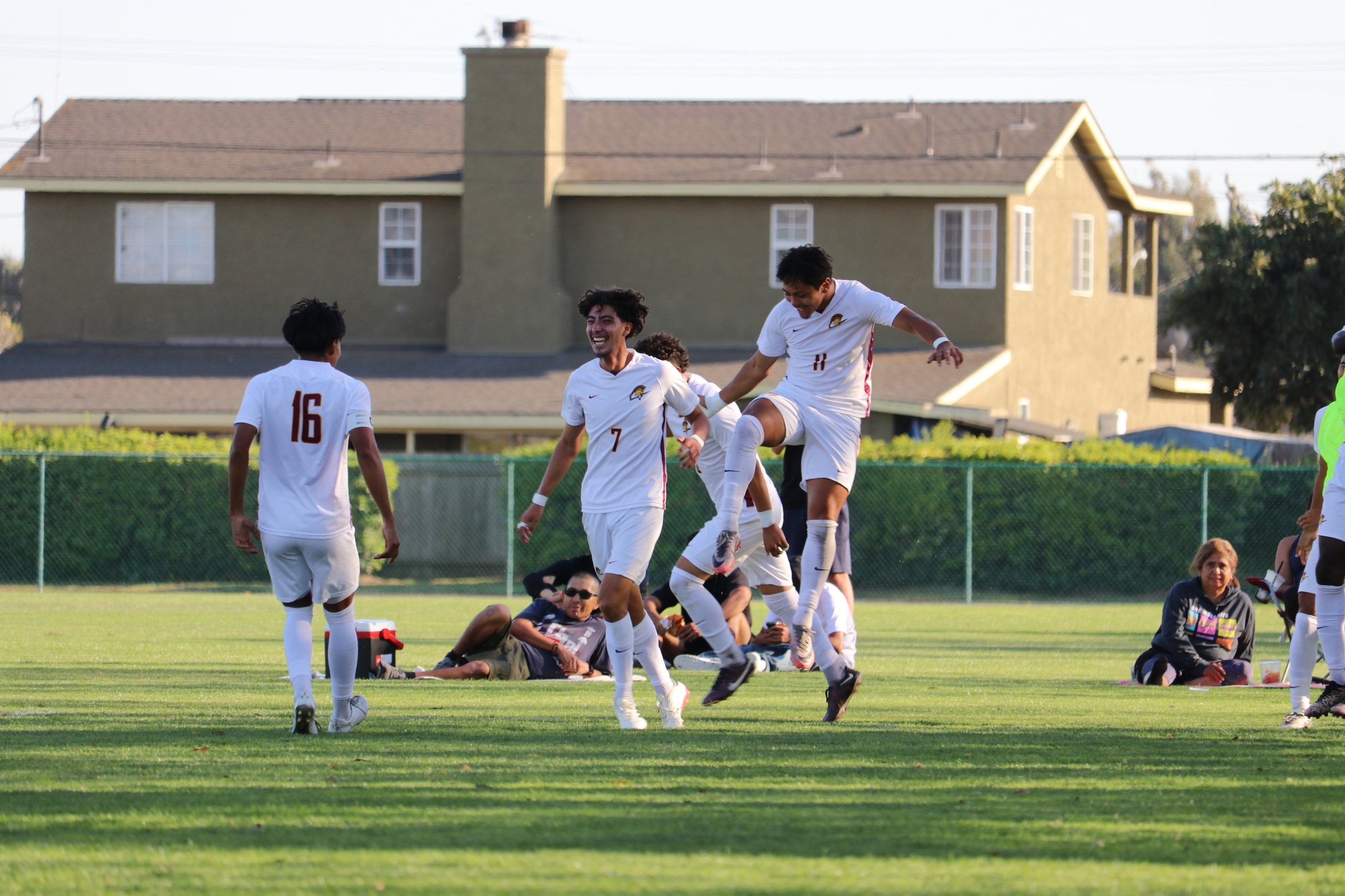 Angel Nolasco celebrates with teammates after scoring a goal on Tuesday (photo courtesy of Shelby Scott, Allan Hancock SID).