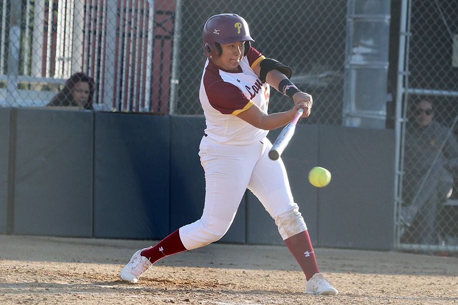 Nathalia Velasquez rips a drive during a game this week, photo by Richard Quinton.