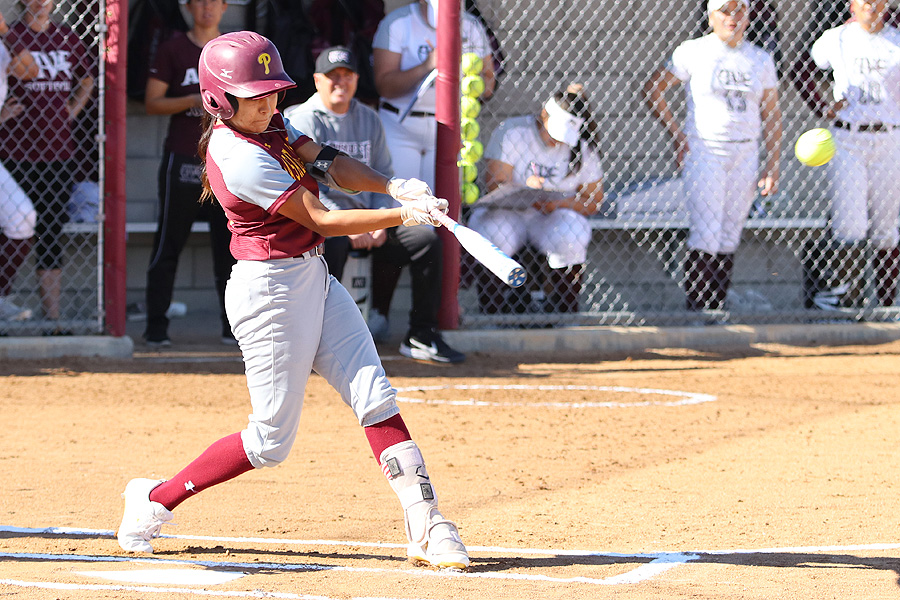 Lancers leadoff hitter Samantha Diaz puts a charge into a ball in a recent game, photo by Richard Quinton.