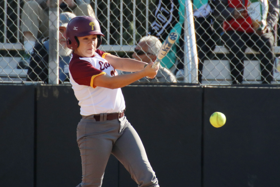 Lancer Olivia Nanez swings at a pitch in a recent game, photo by Richard Quinton.