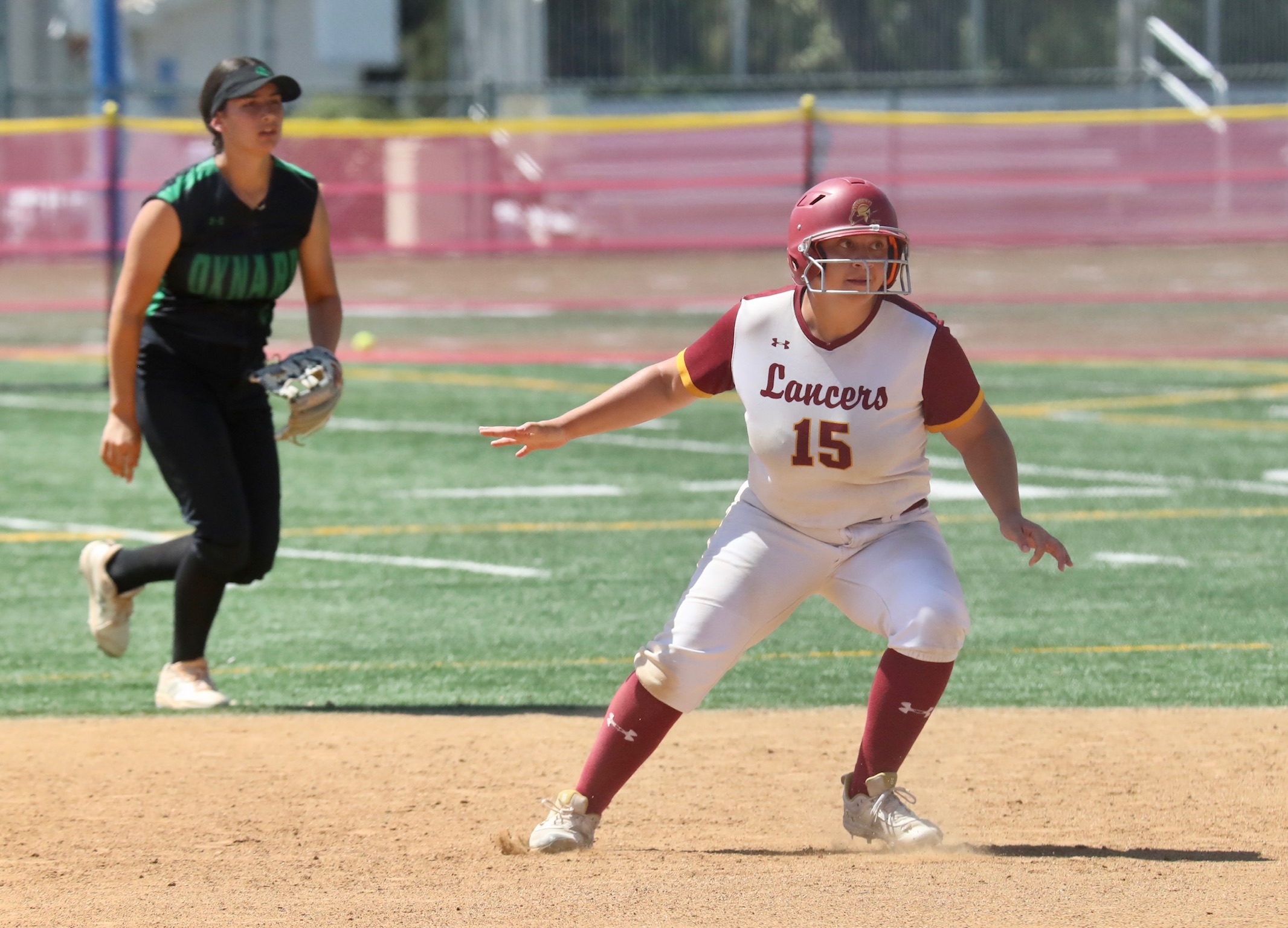 Giselle Lopez takes a leadoff while on the basepaths during PCC's win on Friday (photo by Michael Watkins, PCC Athletics).