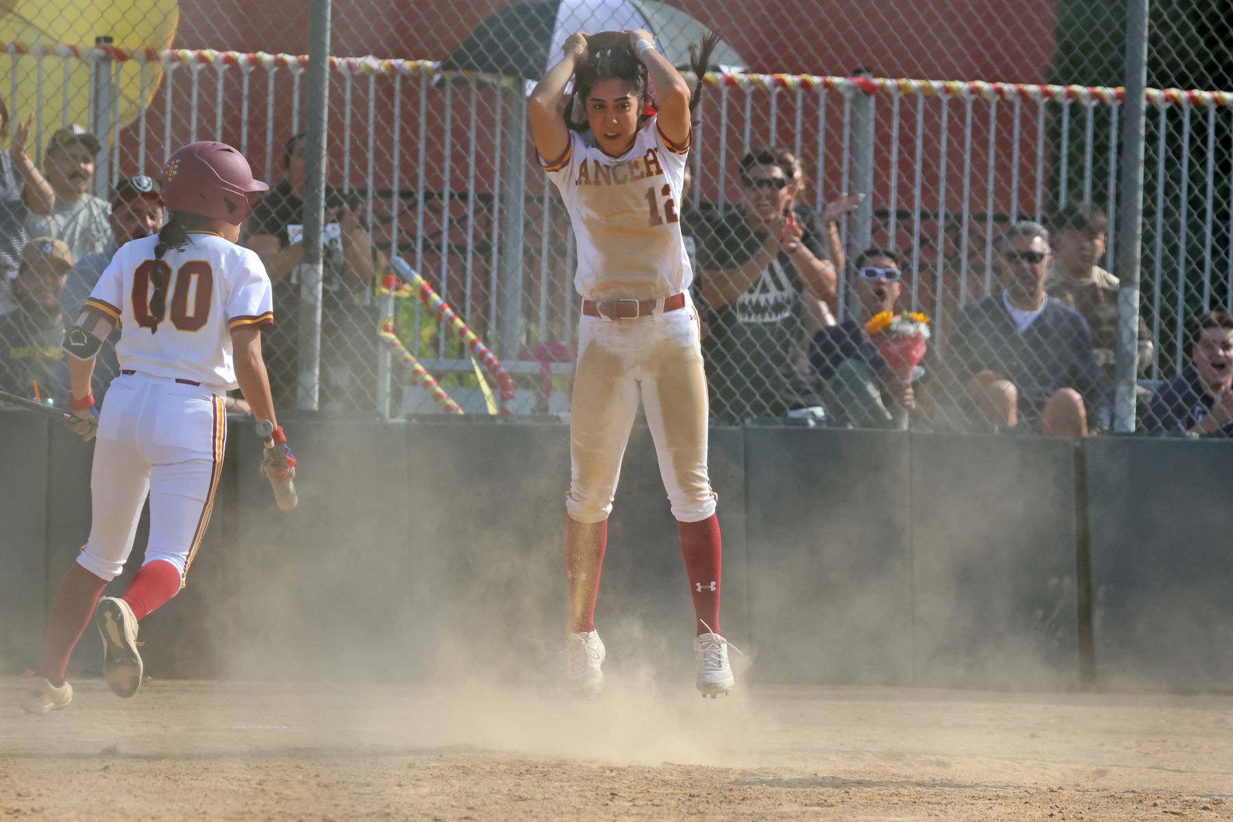 Natalie Shahin jumps for joy after scoring the game-winning run on Wednesday (photo and gallery by Richard Quinton).