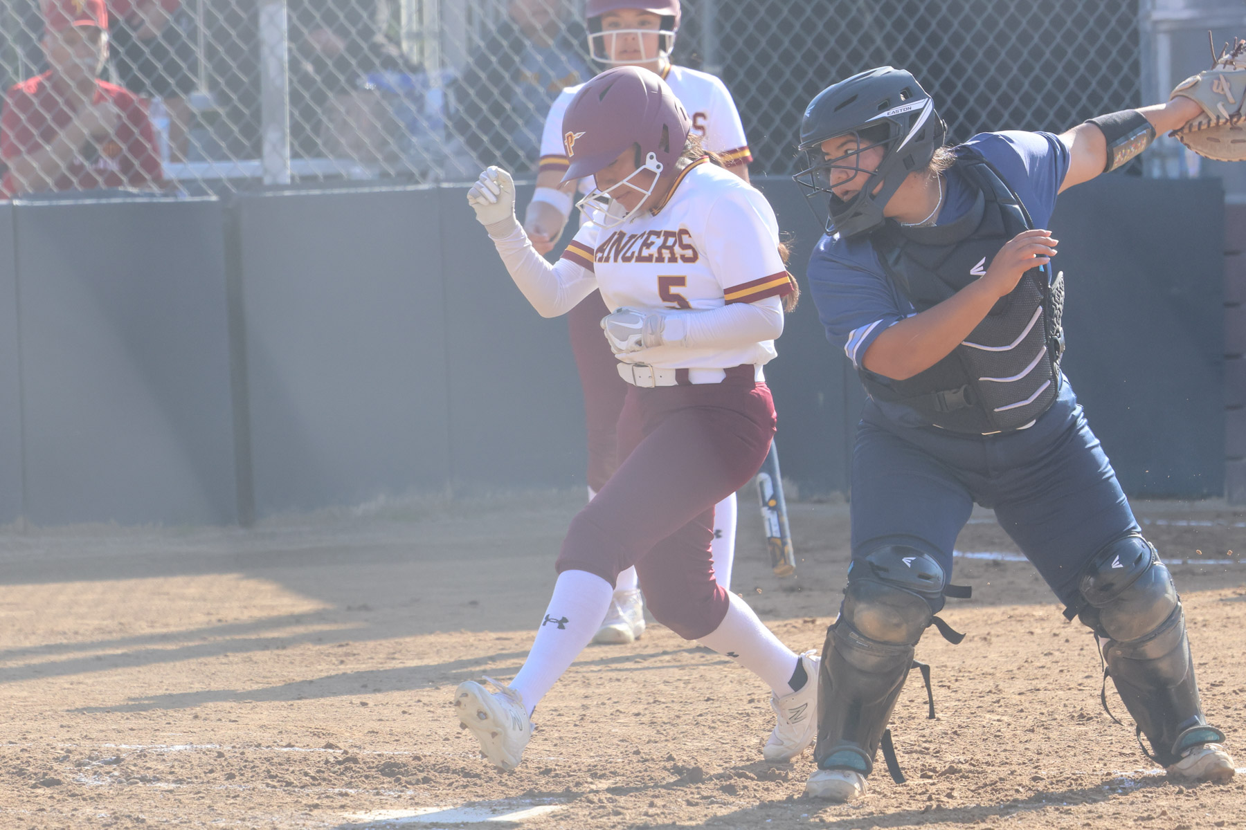 Elizabeth Avalos crosses the plate during PCC's conference-opening defeat on Thursday (photo by Richard Quinton).