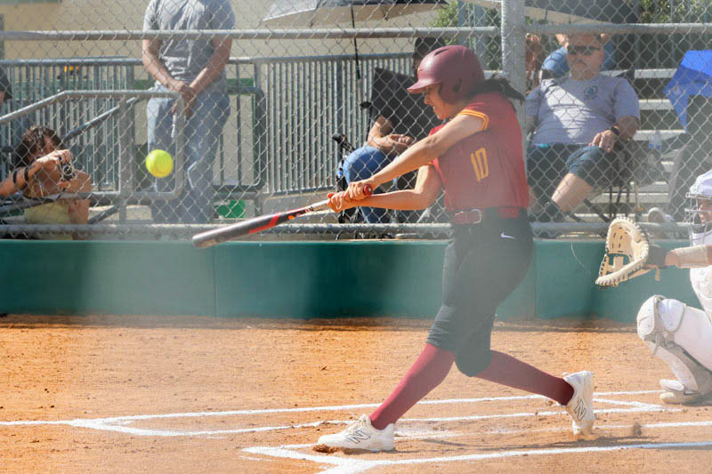 Breanna Negrete crushes the game's second pitch for a home run as PCC softball wins (photo by Richard Quinton).