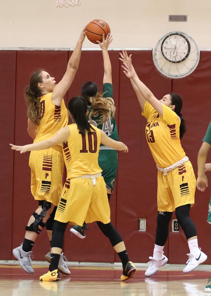 Alisa Shinn (left), Jade Lin (10), and Jacquelyn Luna (right) defend a shot attempt in a recent game. The Lancers host a regional playoff game v. San Diego City College this Wednesday, photo by RIchard Quinton.