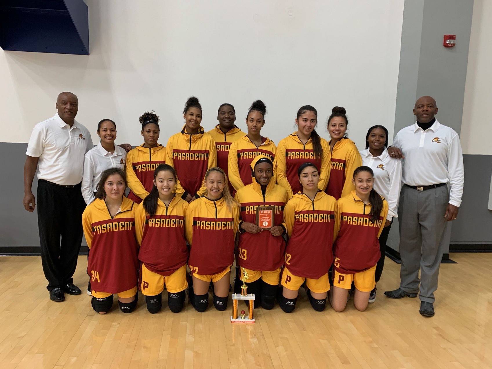 The PCC women's basketball squad takes a team shot following their consolation title at the College of the Sequoias tournament.
