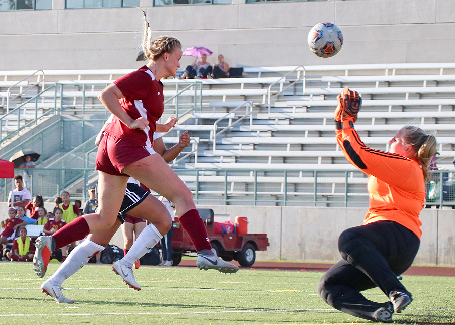 Katy Coats heads in the game-tying goal as PCC women's soccer played to a 2-2 draw v. Palomar Tuesday afternoon, photo by Richard Quinton.