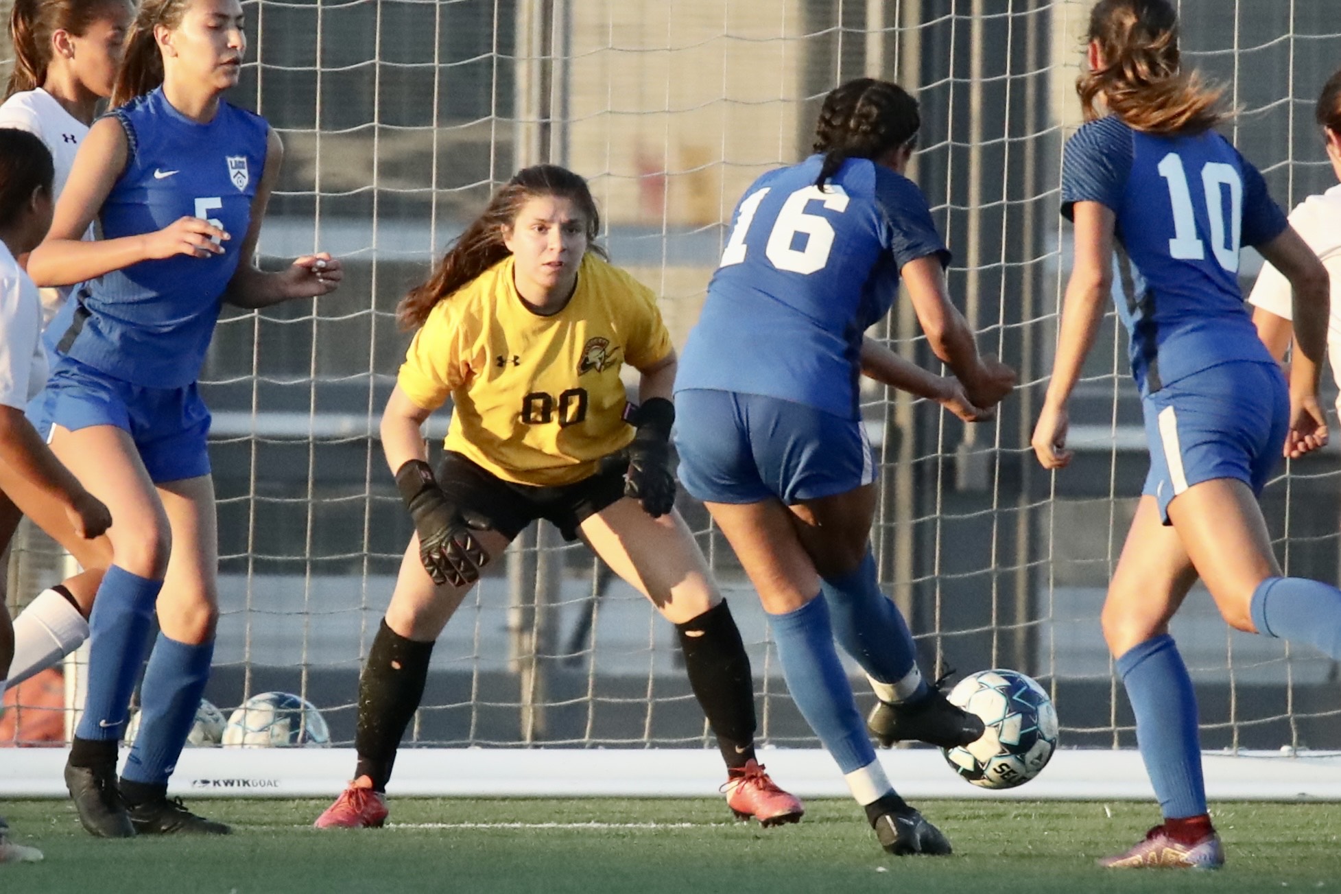 Christina Echeverrie gets ready to make one of her 14 saves during PCC's win at LA City College on Tuesday (photo by Michael Watkins).