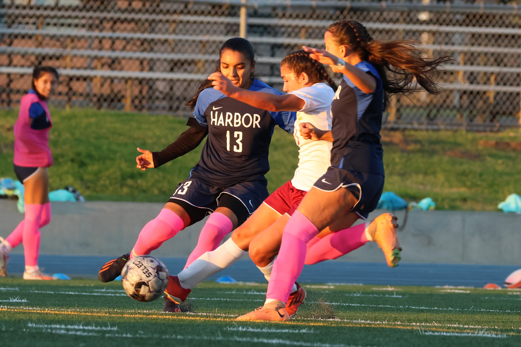 Alexa Espinoza-Gutierrez drives in the Lancers first goal in their SCC-opening win at LA Harbor (photo by Richard Quinton).