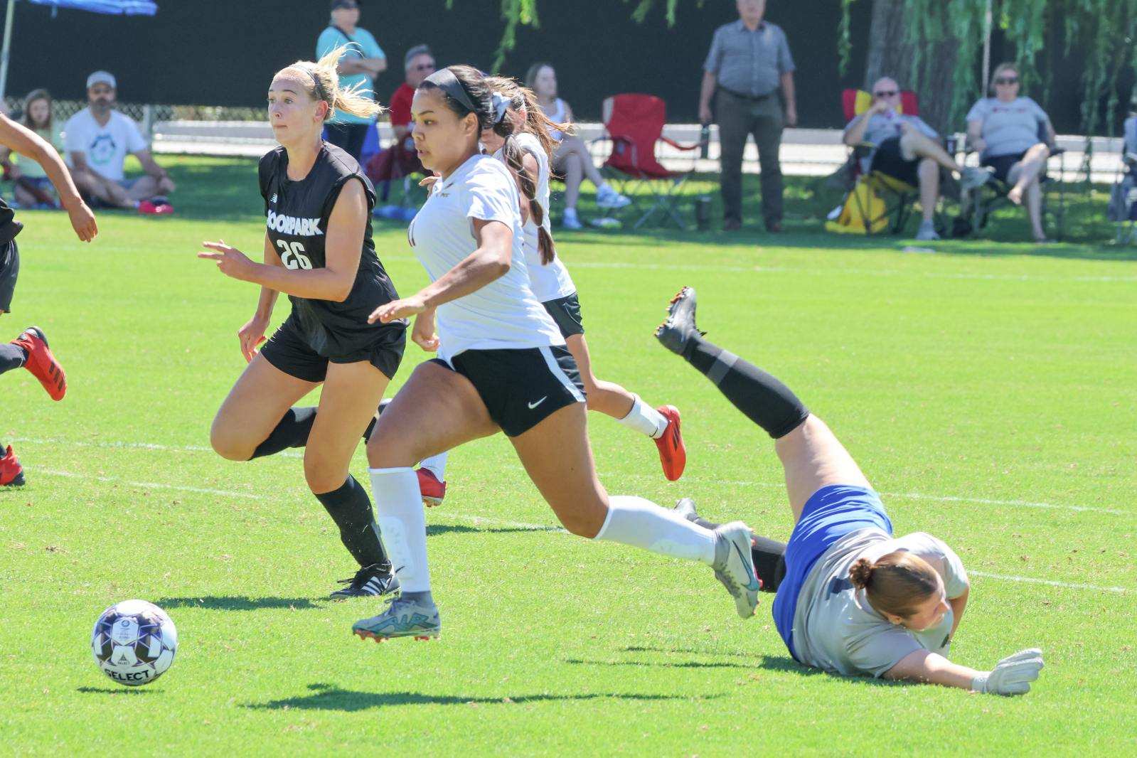 Isabela Guerrero gets by the Moorpark goalie to score one of her two goals in PCC's season-opening win (photo by Richard Quinton).