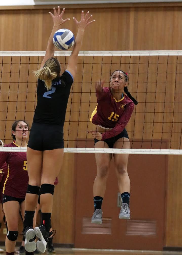Lania Potter drives an attack through the MiraCosta block during the Lancers Round 1 playoff loss Tuesday, photo by Richard Quinton.