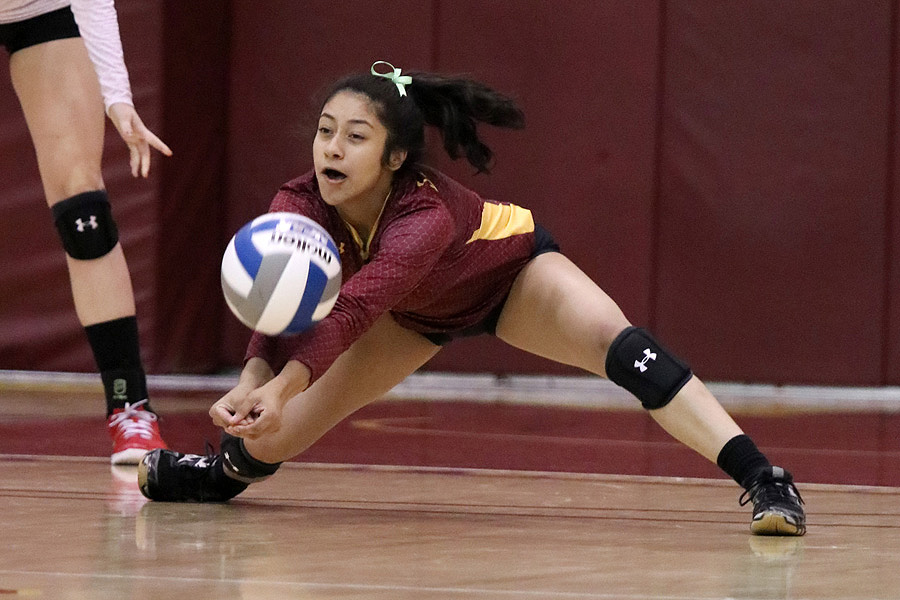 Lancers libero Emily Ramirez gets a dig here during a recent match, photo by Richard Quinton.
