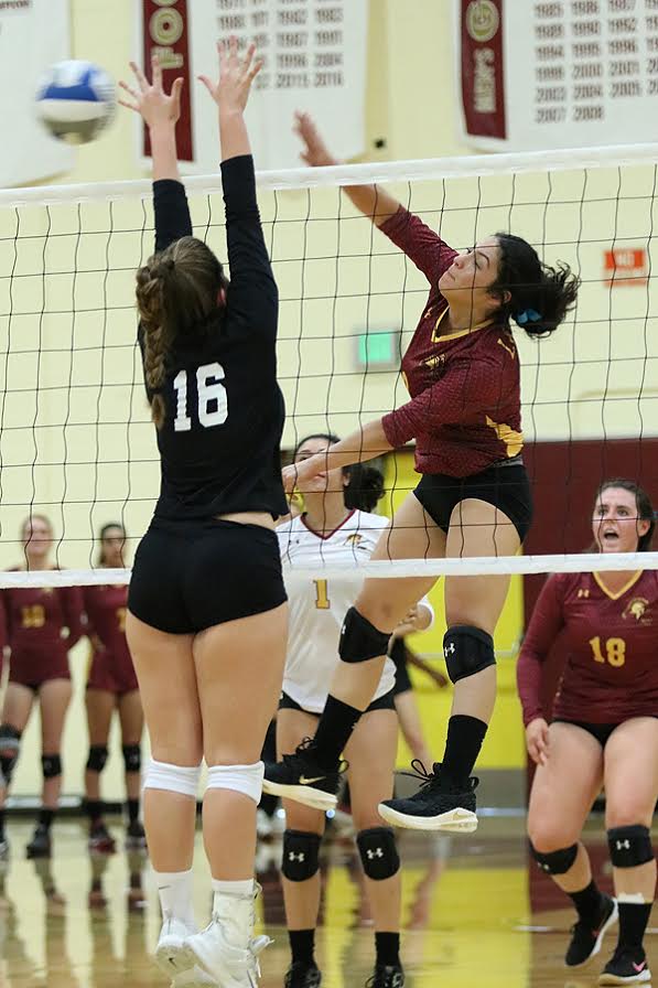 Leslie Rivera pounds a kill during PCC's season-opening win at Saddleback College Wednesday evening, photo by Richard Quinton.