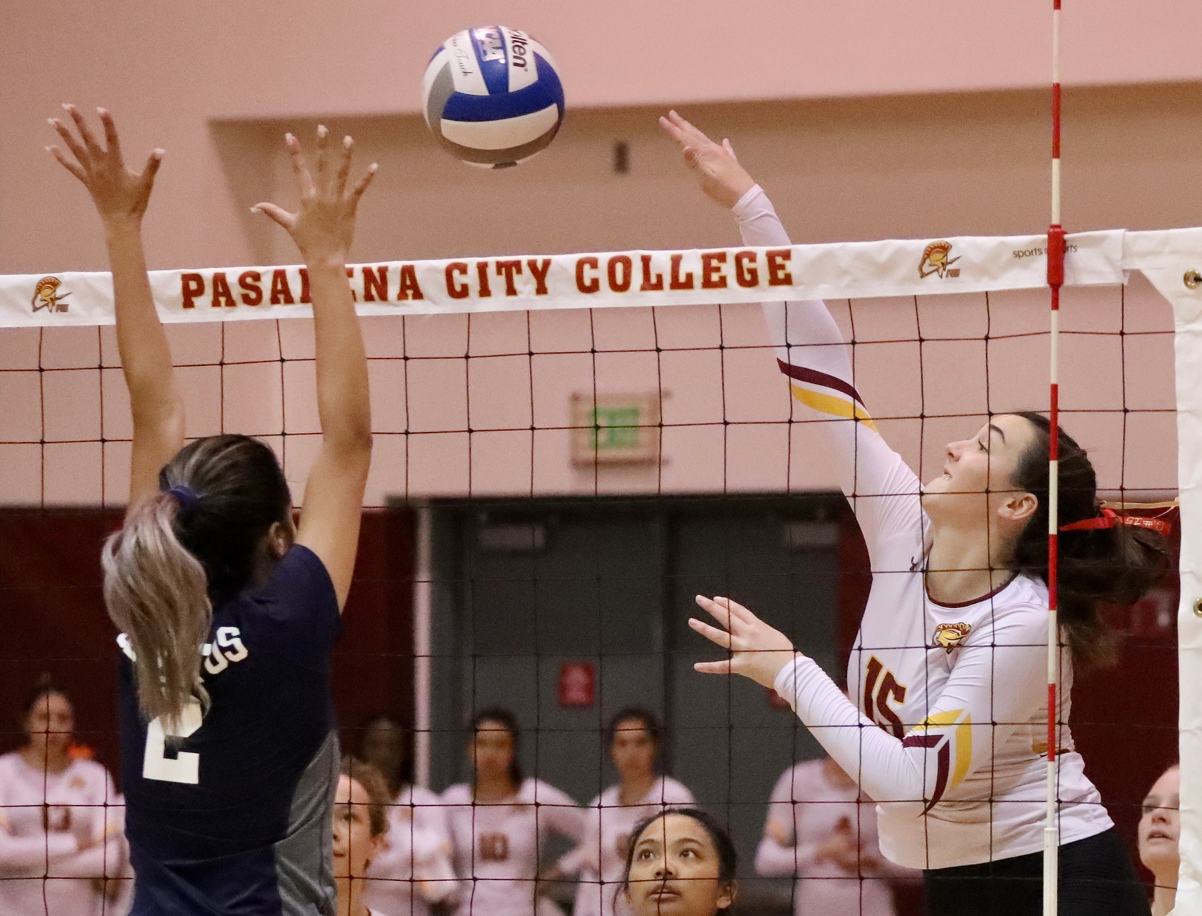 Janell Currier drives an attack during PCC's home sweep over Cerritos Wednesday night, photo by Michael Watkins.
