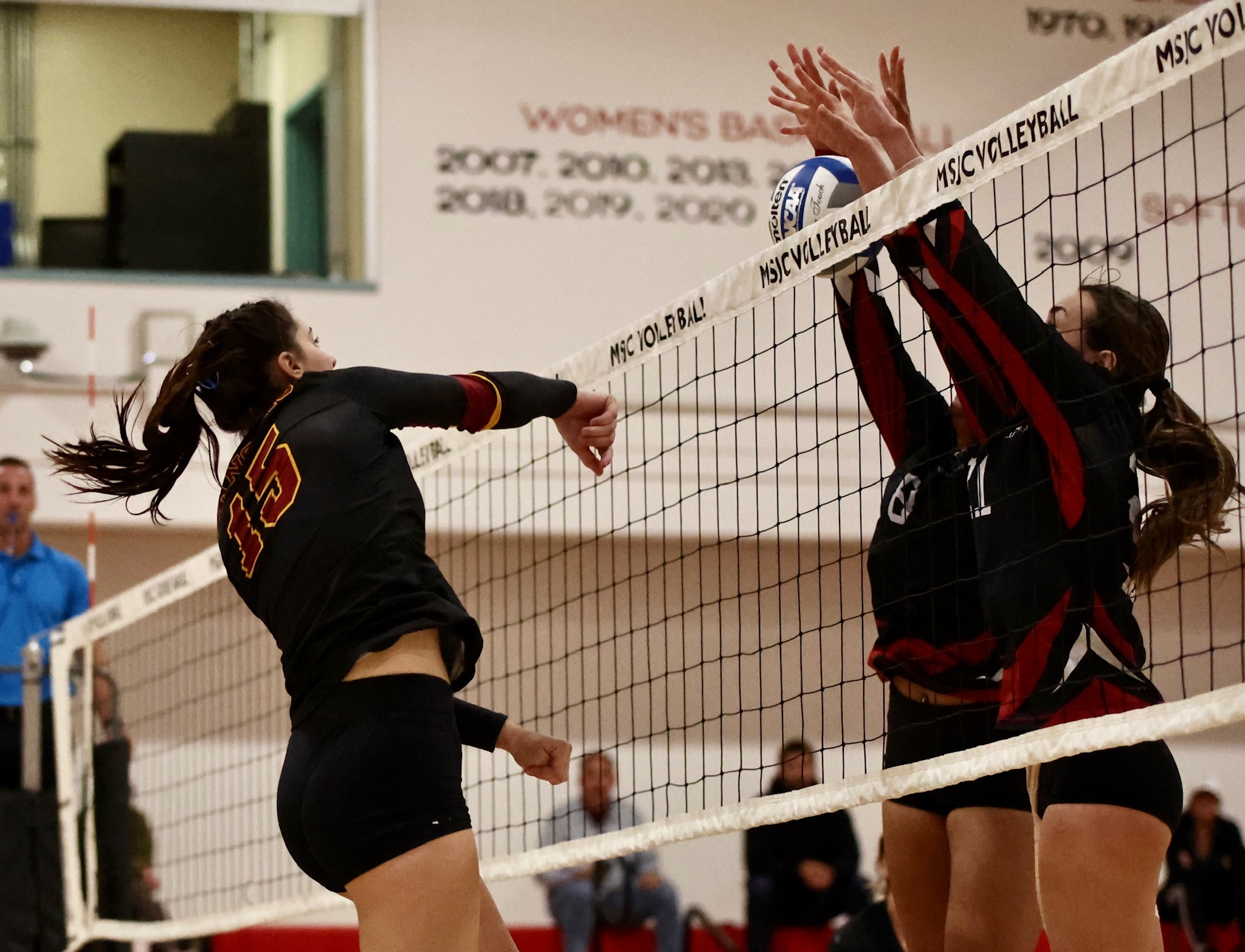 Reese Roper fires an attack through the Mt. San Jacinto block in the Lancers sweep on Nov. 2 (photo by Michael Watkins).